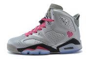 Side view of a silver-gray high-top sneaker with perforated panels, pink laces, black accents, and a visible cushioning window.