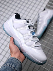 Angled side view highlighting the white upper, layered side panels, and translucent blue outsole.