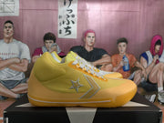 Side profile of a yellow Converse sneaker displaying the star-and-chevron logo and translucent outsole.