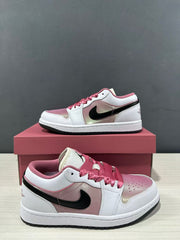 Angled side view showing the pink and white upper, black side branding, and low-profile sole.