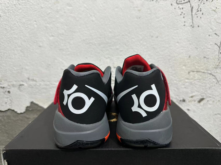 Rear view of black and red basketball shoes with gray heel cushioning and KD graphics