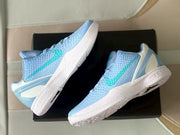 Angled overhead view showing the textured uppers, turquoise Swooshes, and outsoles.