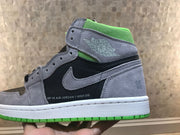 Side profile highlighting the grey and black upper, winged basketball emblem and green outsole.