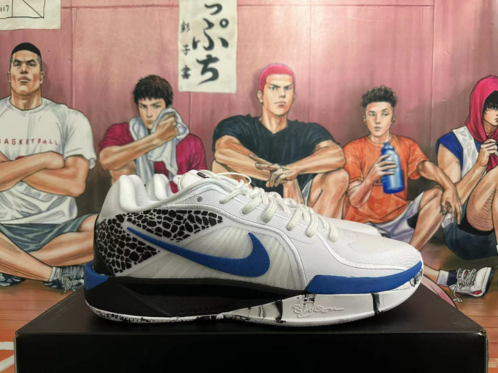 Side view of a white basketball shoe with a blue Nike Swoosh, black leopard-patterned panel, and black-and-blue sole.