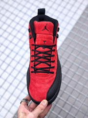 Top view showing the red toe and tongue, black laces, and Jordan logo on the tongue.