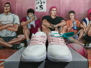 Front view of white Nike shoes with pink laces and visible Air Zoom marking