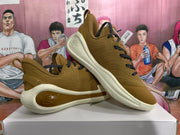 Angled view of the paired sneakers highlighting the lace-up design, heel structure, and sculpted sole details.