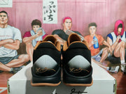 Rear view showing the black mesh collars, gray heel panels, and signature-style heel graphics.