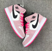 Top-down view of the pair showing pink overlays, white panels, black branding and bright pink outsoles.