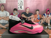 Side profile of a black and pink Nike basketball sneaker showing the swoosh, laces, and sculpted outsole.