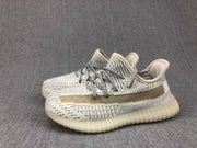 Angled pair view of the cream-white and gray knitted sneakers.