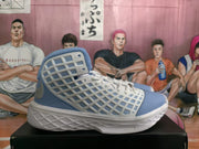 Side profile of a Carolina blue and white high-top basketball sneaker with perforated panels and a patterned sole.