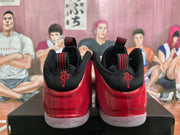 Rear view showing the red heel panels, black collars, red embroidered heel emblems, and translucent soles.