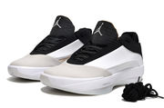 White and black Jordan 40 shoe pair with beige toe accents, shown in a front three-quarter view.