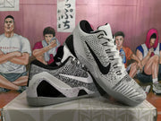 Angled view of the pair displaying the patterned uppers, contrasting side Swooshes, and sculpted grey soles.