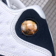 Close-up of the circular ankle detail and perforated white upper.