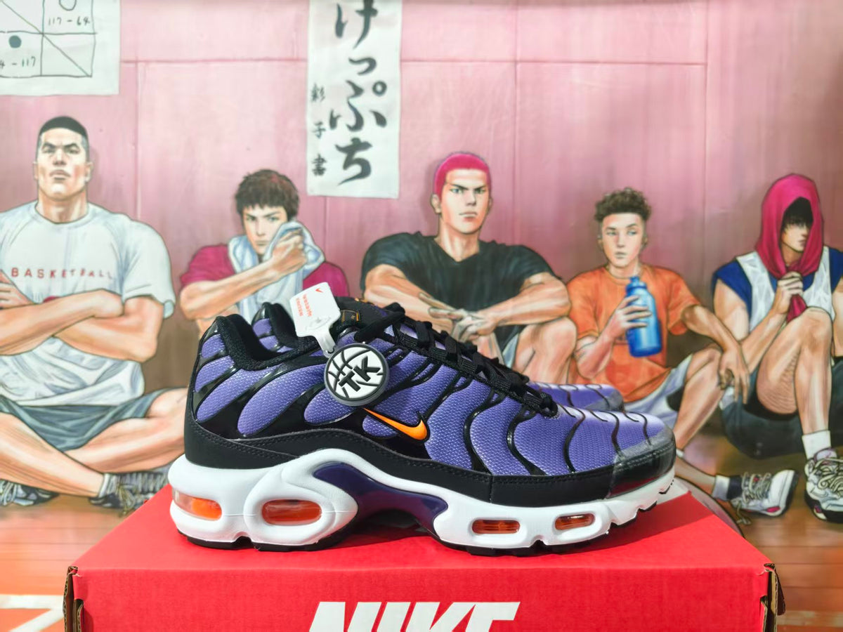 Nike Air Max Plus sneakers in black and purple with orange accents, shown from the side