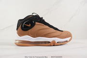 Side profile of the brown sneaker with black trim and a white midsole