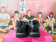 Rear view of black sneakers with sculpted heel details