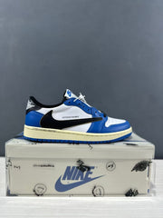 Single blue and white low-top sneaker shown in side profile on a shoe box.