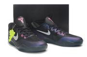 Black and purple Kobe 11 pair displayed against a dark background