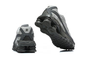 Rear and outsole views of grey Nike Shox Ride 2 sneakers.