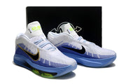 White and blue Nike GT Hustle 3 pair displayed in front of a dark shoe box.