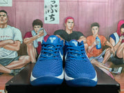 Front view of blue Nike Kobe basketball shoes with textured uppers and white midsoles.