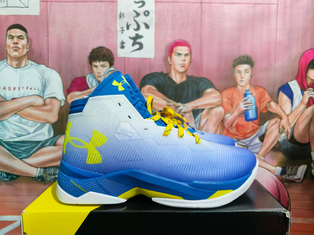 Side view of royal blue and yellow Under Armour basketball sneakers displayed on a shoe box.