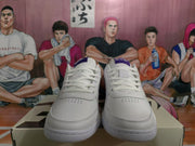 Front view of white Nike lace-up sneakers showing perforated toe areas and blue-purple tongue details.