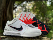 Nike Kobe 4 shoes shown with the patterned black, white, and red outsoles