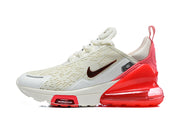 Side view of a white Nike Air Max 270 Premium sneaker with red accents