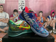 Angled view of both mismatched sneakers, showing the orange-green shoe beside the blue patterned shoe with red and blue accents.