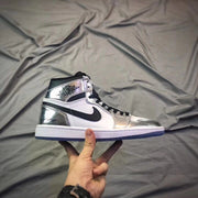 Full side profile of a white and silver Jordan high-top sneaker with black Swoosh and translucent blue outsole.