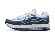 Side view of a white, blue, and dark gray Nike Air Max sneaker.