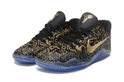 Pair of black and gold patterned Kobe 11 shoes viewed from the front