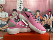 Pair of pink Nike low-top sneakers with contrasting side swooshes and white outsoles.