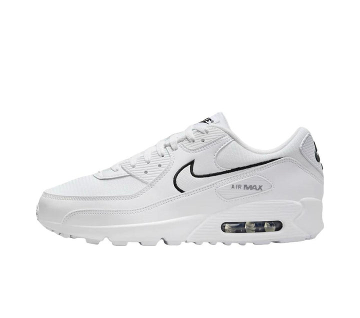 Side view of a white Nike Air Max 90 sneaker with a black-outlined Swoosh and visible heel cushioning window.
