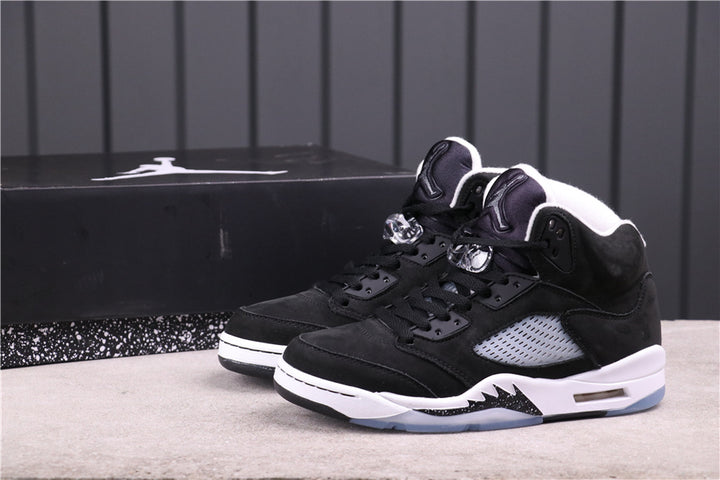 Pair of black and white Jordan high-top sneakers shown from a front three-quarter angle.