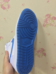 Close view of the blue rubber outsole with circular traction and segmented tread.