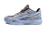 Side view of blue-gray camouflage Nike Ja 2 shoe with brown laces