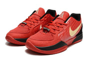 Pair of red Nike Ja 2 basketball shoes with black and gold accents