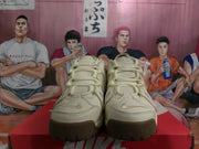 Front view of beige Nike Air More Uptempo sneakers showing the laces and toe design