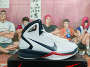 Side profile showing the navy swoosh, white upper, and red midsole accent