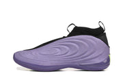 Side profile of a purple basketball shoe with black collar details and a green heel accent.