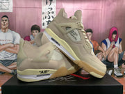 Pair of khaki high-top sneakers displayed at an angle, showing the side panels, laces, padded collars, and translucent outsoles.