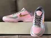 Front and side view showing the pink perforated toe box, gray laces and Kobe tongue emblem.