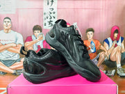 Pair of black sneakers showing the side and upper details