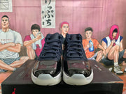 Front view showing black glossy toe panels, dark blue uppers, dark laces, and translucent toe outsoles.