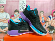 Pair of black Nike basketball shoes showing their side panels, blue accents, purple heels, and white outsoles